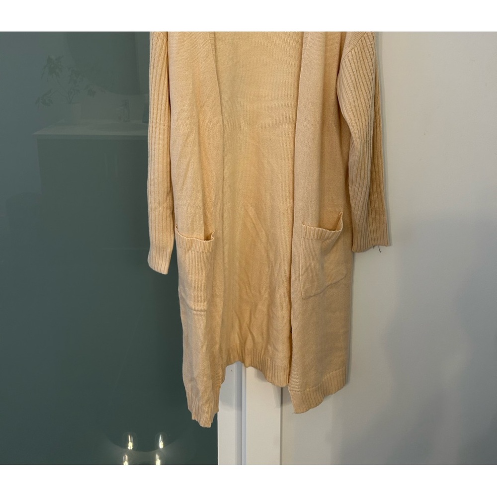 Women’s beige cardigan.
